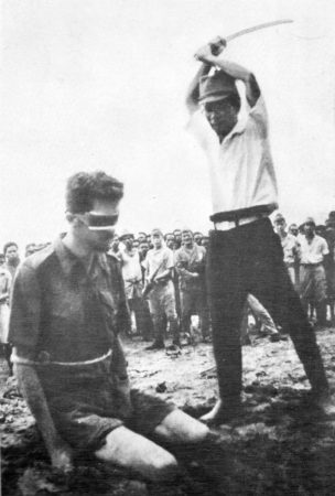 Sgt. Leonard G. Siffleet, blindfolded and arms tied, is about to be beheaded by Yasuno Chikao. The photo was found on the body of a dead Japanese soldier. 