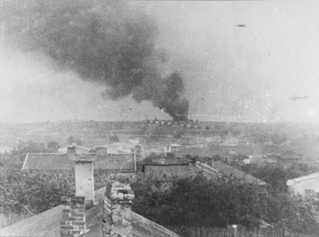 KZ Majdanek concentration camp viewed from the village of Dziesiata, Poland. The smoke in the background is from a burning pyre of corpses in the camp. 