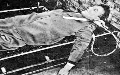 The body of Arthur Seyss-Inquart after his execution by hanging. Photo by anonymous (16 October 1946). PD-U.S. Government. Wikimedia Commons.