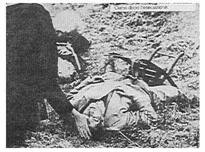Verona priest gives the extreme anointing to Galeazzo Ciano after Ciano’s execution. Note the position of the chair as if Ciano had turned it just before being shot. Photo by anonymous (11 January 1944). https://wwwomnia.ie
