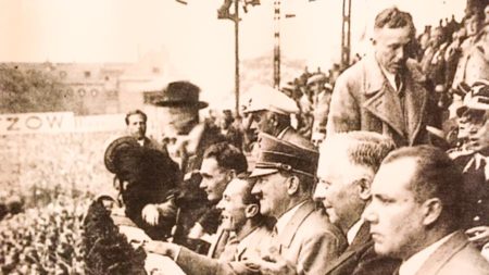 Adolf Hitler, Joseph Goebbels ), and senior Nazi officials attending the quarter-final of the 1936 Olympic games in Berlin
