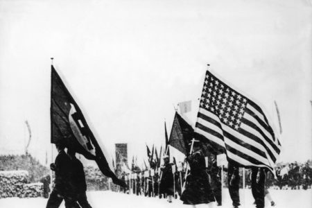 The American flag follows the Nazi flag at the opening ceremonies of the 1936 Winter Olympics.
