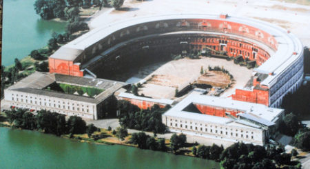 Aerial view of the contemporary Party Congress Hall. The Documentation Center is in the right-hand foreground. Photo by anonymous (date unknown). Documentation Center. Photo by Sandy Ross (2017)