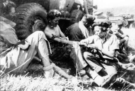 Soldiers being treated by the Rochambelles during the Normandy campaign.