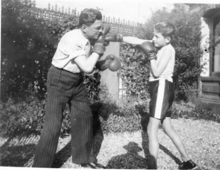 Dr. Jackson giving his son, Pete, boxing lessons in the garden of their apartment at 11, avenue Foch.