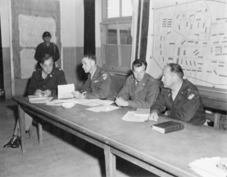 American prosecution team at the 1947 Nordhausen War Crimes Trials. From left to right: Lt. Col. William Berman, Capt. William McGarry, First Lt. William Jones, and Capt. John Ryan.