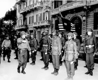 Maj. Gen. Edward M. Almond, Commanding General of the 92nd Infantry Division in Italy inspecting the troops before a decoration ceremony. Photo by anonymous (c. March 1945). PD-U.S. government. Wikimedia Commons.