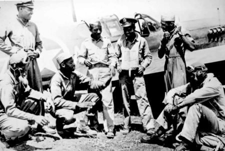 Tuskegee Airmen credited with shooting down 8 of the 28 German planes destroyed in dogfights over new Allied beachheads. Photo by anonymous (c. February 1944). National Archives and Records Administration. PD-U.S. government. Wikimedia Commons.