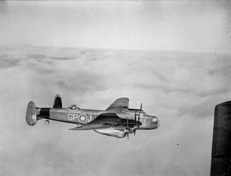 RAF Avro 683 Lancaster heavy bomber in flight. Photo by Stanley Arthur Devon (c. between 1942 and 1945). Imperial War Museum; Air Ministry Second World War Official Collection. PD-U.K. public domain. Wikimedia Commons.