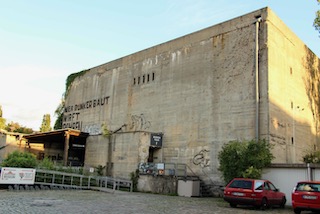 Berlin air raid shelter built in 1943 next to the Anhalter Bahnhof. Today it is the Berlin Story Museum. Photo by Fred Romero (17 August 2016). Berlin-Anhalter Hochbunker/Berlin Story Bunker. PD-CCA-2.0 Generic. Wikimedia Commons.