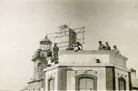 Captured German Coastwatcher radar near lighthouse at Cap de Carterêt, France. Photo by anonymous (c. July 1944). National Archives. Courtesy of Guy Allan Farrin. “30 [Commando] Assault Unit” (www.30au.co.uk).