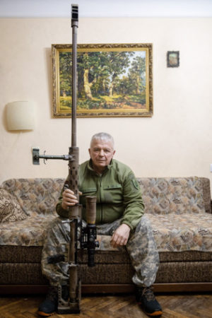 Vyacheslav Kovalskiy with the rifle he used to shoot at a Russian soldier more than two miles away. Photo by Joseph Sywenkyi (date unknown).