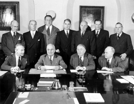 President Harry S. Truman and his cabinet. Seated, left to right: Secretary of Defense James Forrestal, President Truman, Vice President Alben Barkley, Treasury Secretary John Snyder. Standing, left to right: Commerce Secretary Charles Sawyer, Acting Secretary of State Robert Lovett, Interior Secretary Julius Krug, Attorney General Tom Clark, Agricultural Secretary Charles Brannan, Labor Secretary Maurice Tobin, Postmaster General Jesse Donaldson. Photo by anonymous (c. January 1949). PD-U.S. Government. Wikimedia Commons.