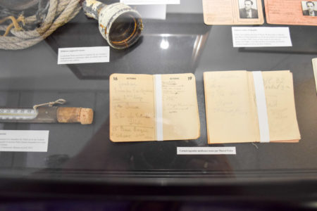 Medical notebooks and diary kept by Marcel Petiot. Photo by Sandy Ross (c. September 2022). Paris Police Museum.
