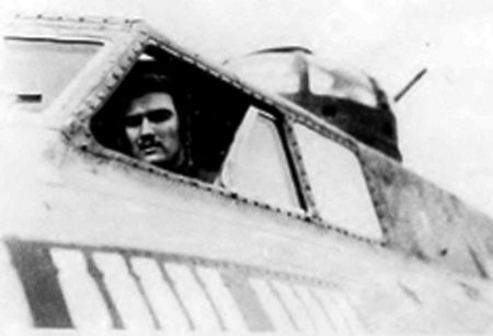 Cal Worthington in the pilot seat of his B-17, “Paper Doll”. Photo by anonymous (c. 1944). PD-U.S. government.
