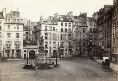 Place Dauphine on the Île de la Cité. Photo by Charles Marville (c. 1865). This is a view to the east. Hidden behind the arch and buildings is the Palais de Justice. PD-Author’s life plus 100 years or fewer. Wikimedia Commons.