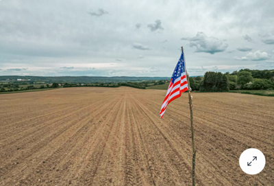 Locals erected a makeshift American flag marking the site where Chaufty's plane crashed in near the village of St. Elliers Les Bois, France. (NBC News)