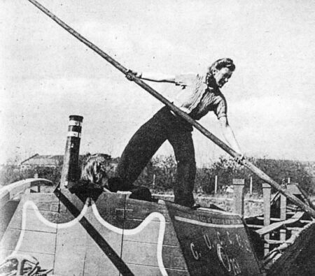 Audrey Harper operates a bargepole, as Evelyn Hunt looks on. Photo by anonymous (c. 1944). “Far From Idle: The Women Canal Workers of the Second World War” (author: Rose Staveley-Wadham), The British Newspaper Archive, 4 February 2021. Originally published by The Sphere, 15 April 1944. https://blog.britishnewspaperarchive.co.uk.