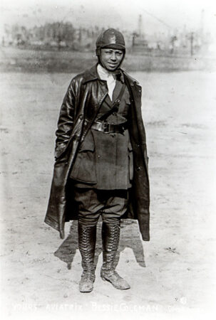 Bessie Coleman, the first licensed Black female pilot to perform in the United States. Photo by Dove & Porter (c. 1922). UCLA Library Digital Collections. Miriam Matthews Photograph Collection. PD-Published before 1 January 1929. Wikimedia Commons.