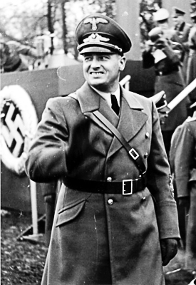 Hans Frank, Governor-General of Poland during a police parade. Photo by anonymous (c. 1939). Bundesarchiv, Bild 121-0270/CC-BY-SA 3.0. PD-CCA-Share Alike 3.0 Germany License. Wikimedia Commons.