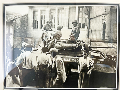 Here we see an American tank stopped in the village of Einvaux to the east of Strasbourg. Carl’s future mother-in-law (his wife’s mother) is standing on the tank offering quiche Lorraine to the soldiers. The building in the background is a former convent that was used as the village school and upstairs is where his future wife and her family lived. Photo by anonymous (date unknown). The three photos were likely taken by a neighbor (date unknown). Courtesy of Carl S.