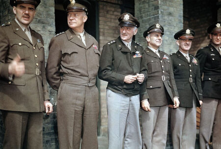Generals gather for the occasion of the awarding of the Distinguished Service Cross to Col. Blakeslee and Capt. Gentile. Left to right: Gen. Jesse Auton, Gen. Eisenhower, Gen. Carl Spaatz, Gen. Jimmy Doolittle, Gen. Kepner, and Col. Blakeslee. Photo by anonymous (c. April 1944). PD-U.S. Government. Wikimedia Commons.